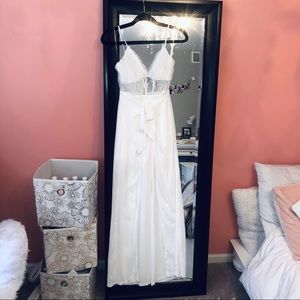 White jumpsuit with with mesh/lace.